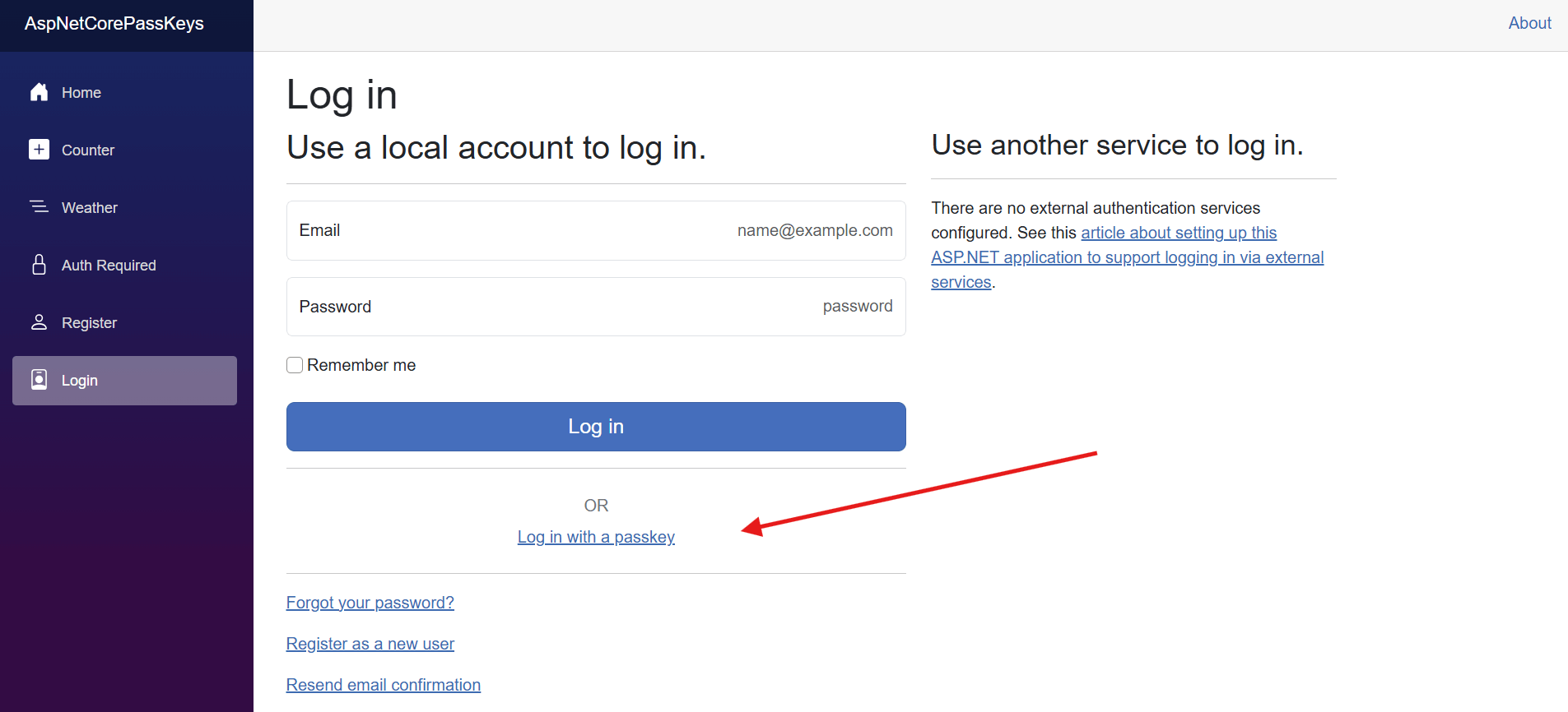 The login page contains a 'log in with a passkey' link